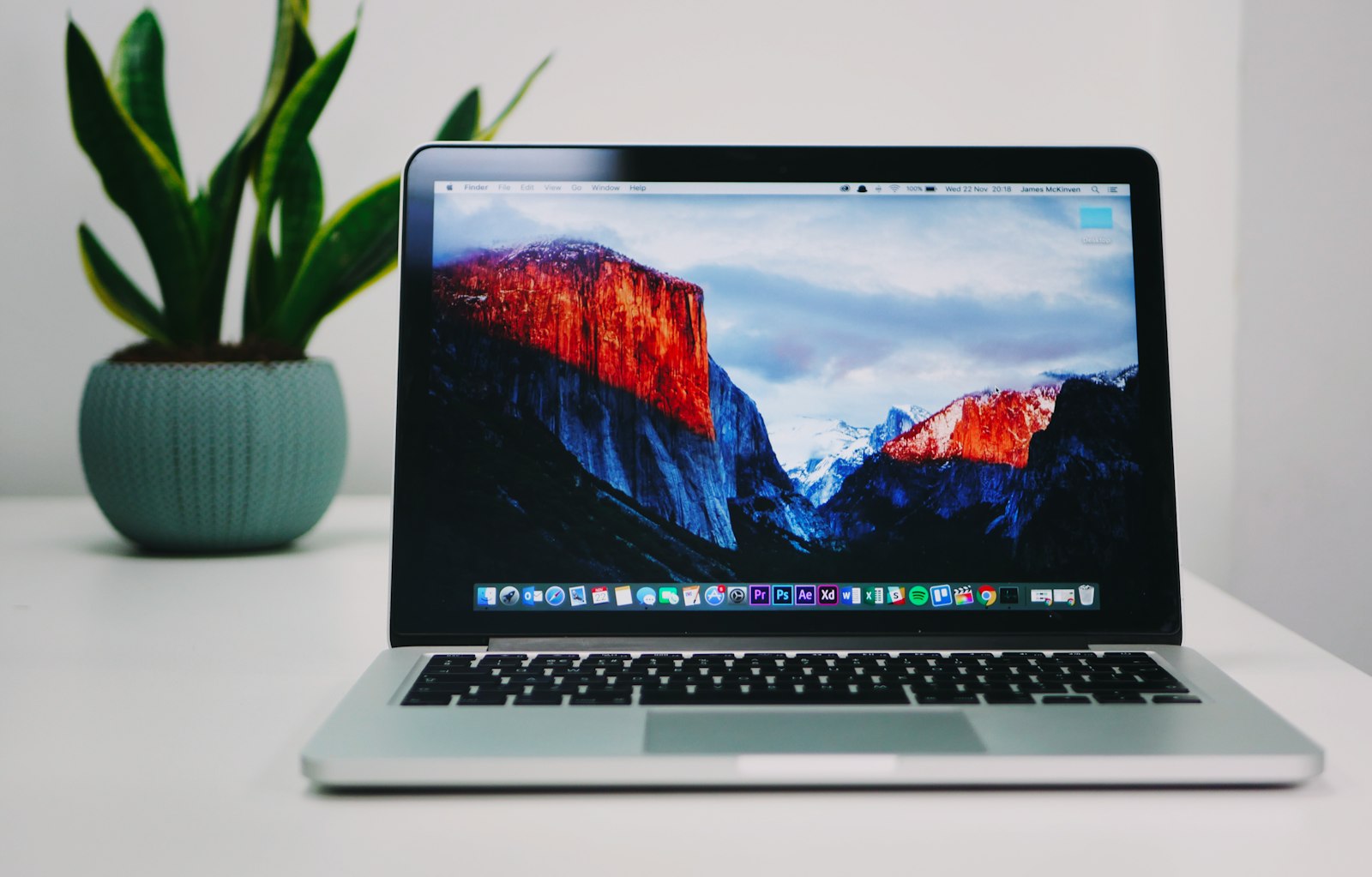 MacBook on a clean desk representing private offline dictation